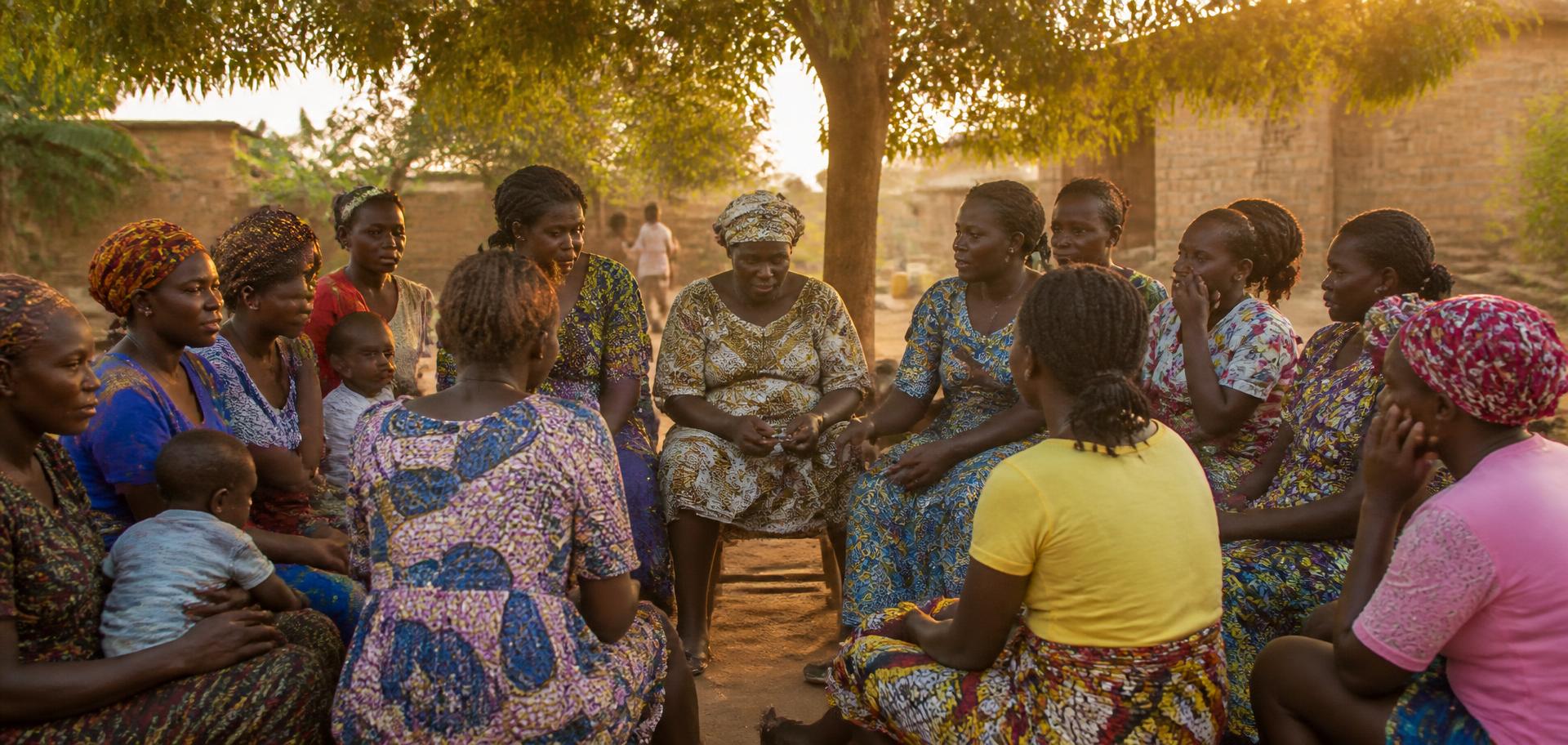 Women and girls gathered for a community health conversation in Cameroon