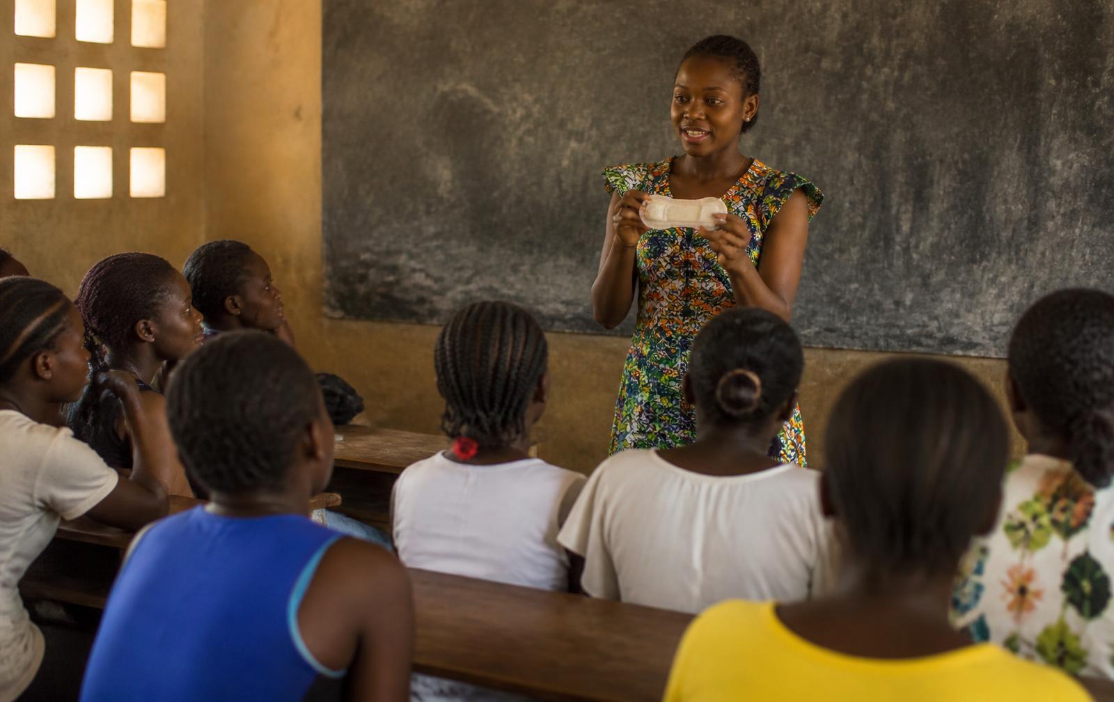 A Mavena health educator leading a menstrual-health session for students